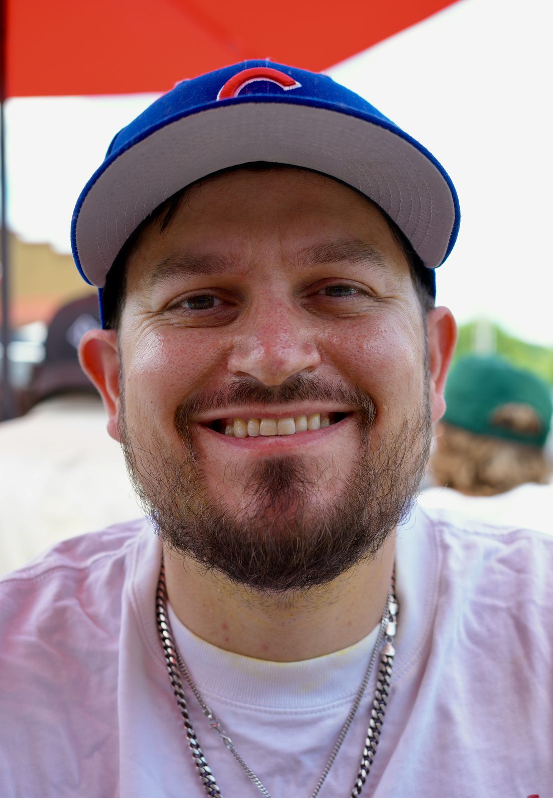 Cody outdoors in a Chicago Cubs cap